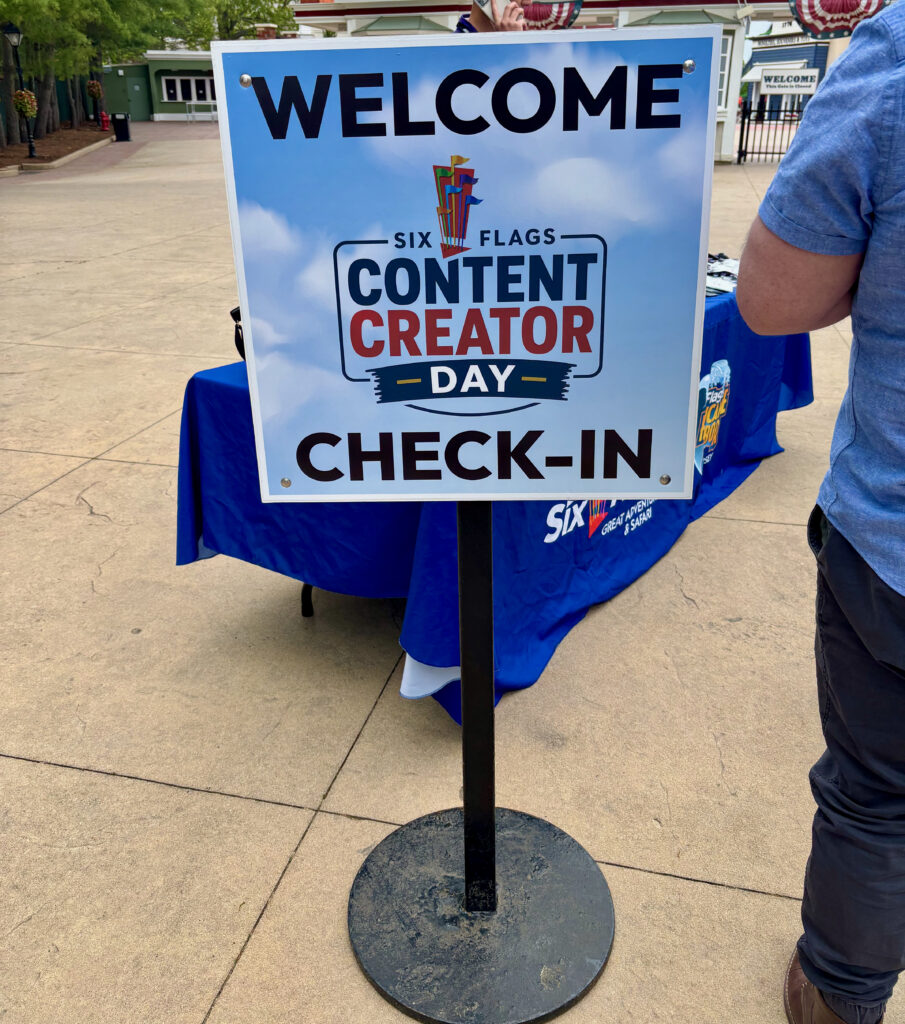 A sign saying "Welcome content creator day check-in" for Six Flags Great Adventure review