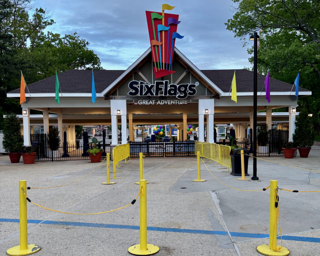 Six Flags Great Adventure review entrance photo featuring the main gate and park signage with colorful flags.